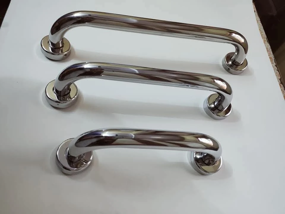 Three chrome pull handles from the Riddhi-Siddhi product collection